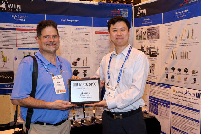 Ira presenting Aj with an award